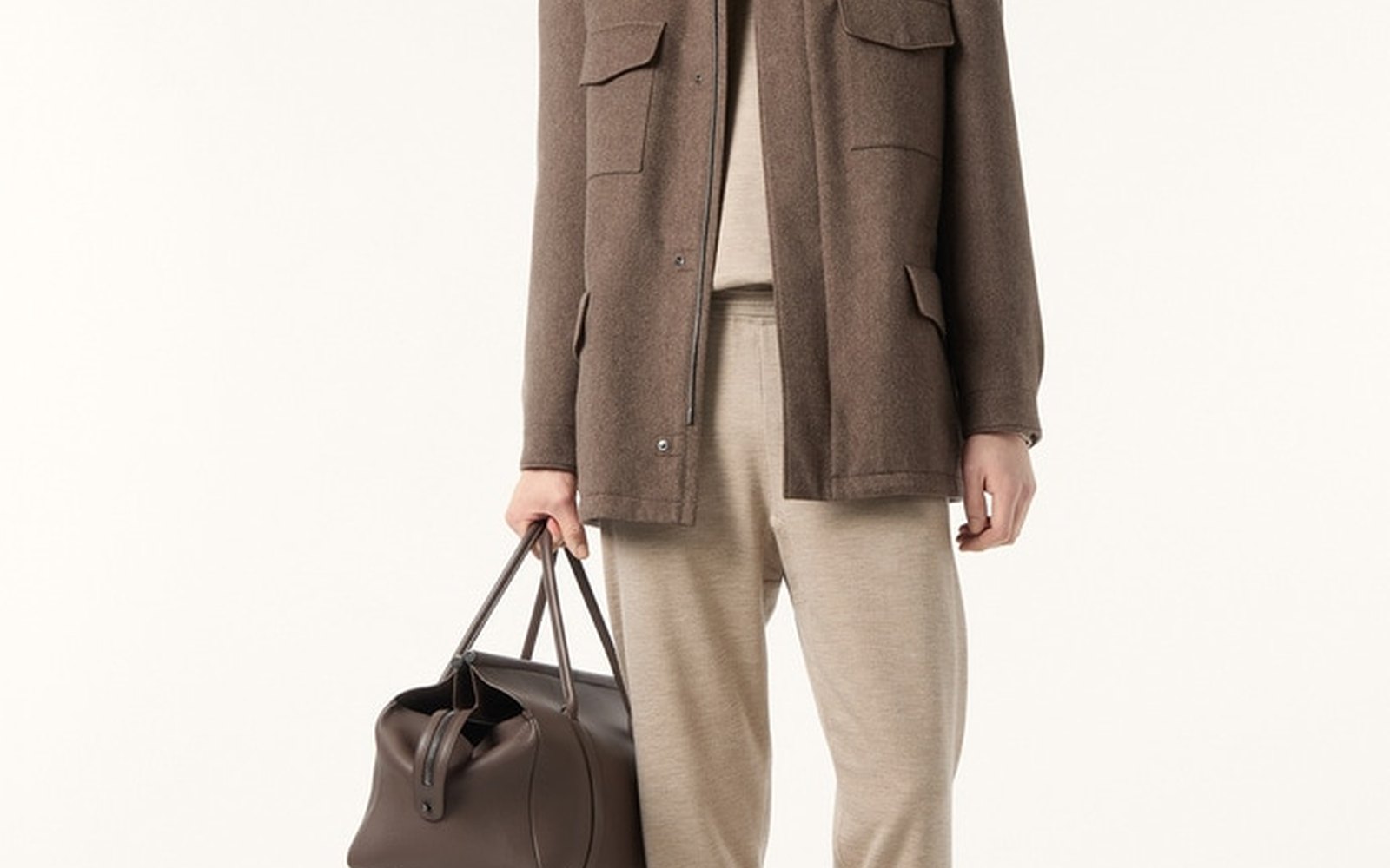 Editorial illustration of a tailored cashmere travel jacket